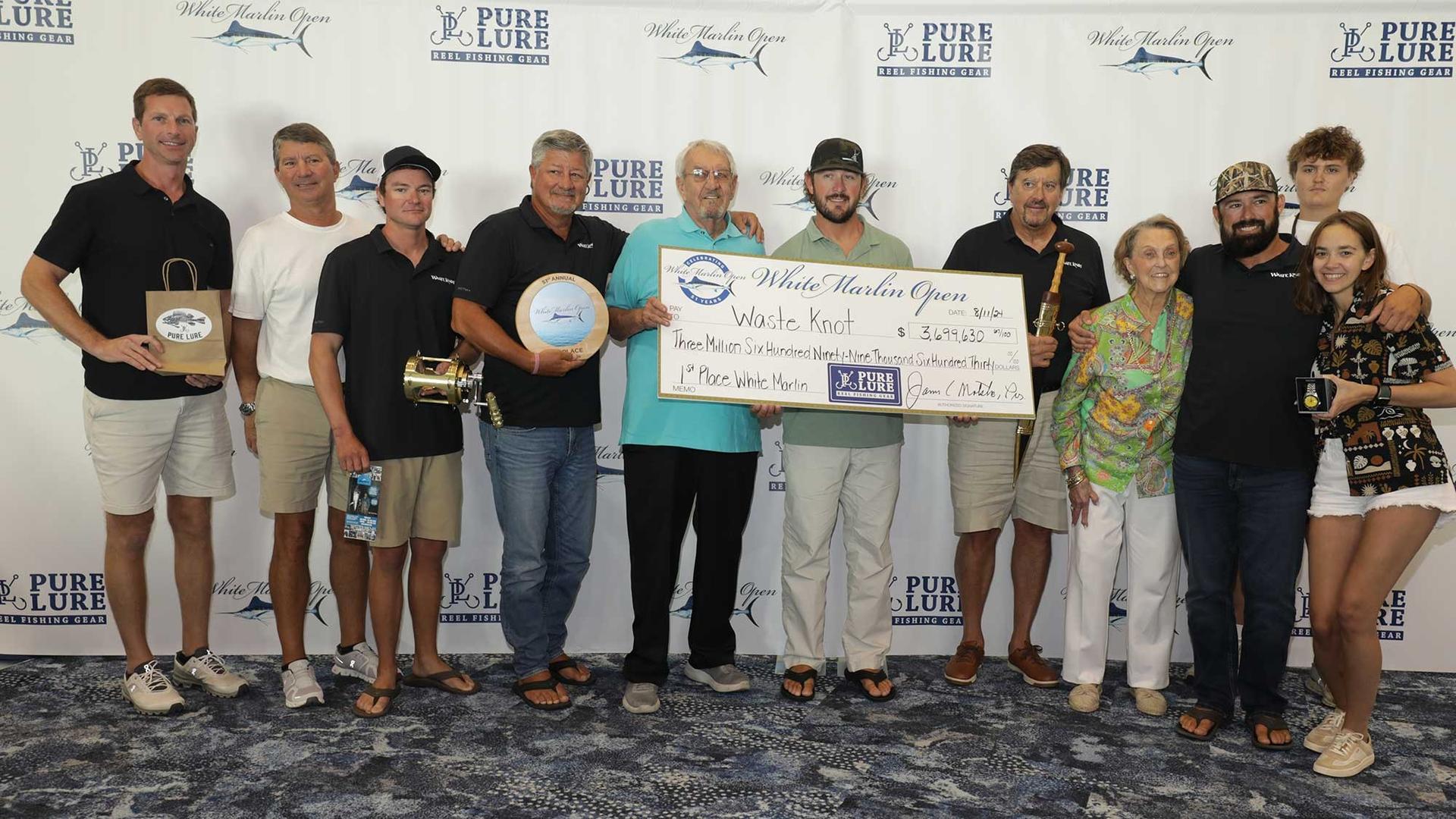 Team Waste Knot Sportfishing posing with their 1st place check at the 2024 White Marlin Open